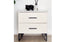 white bedside table with marble top and black legs styled modern bedroom