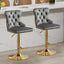Set of grey velvet Sahara swivel bar stools with gold stand styled at white kitchen bar