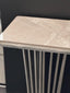 Close-up of Serena console table with polished silver frame and grey marble top.