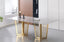 Serena Dining Table gold stainless frame with sophisticated grey marble top and modern design.